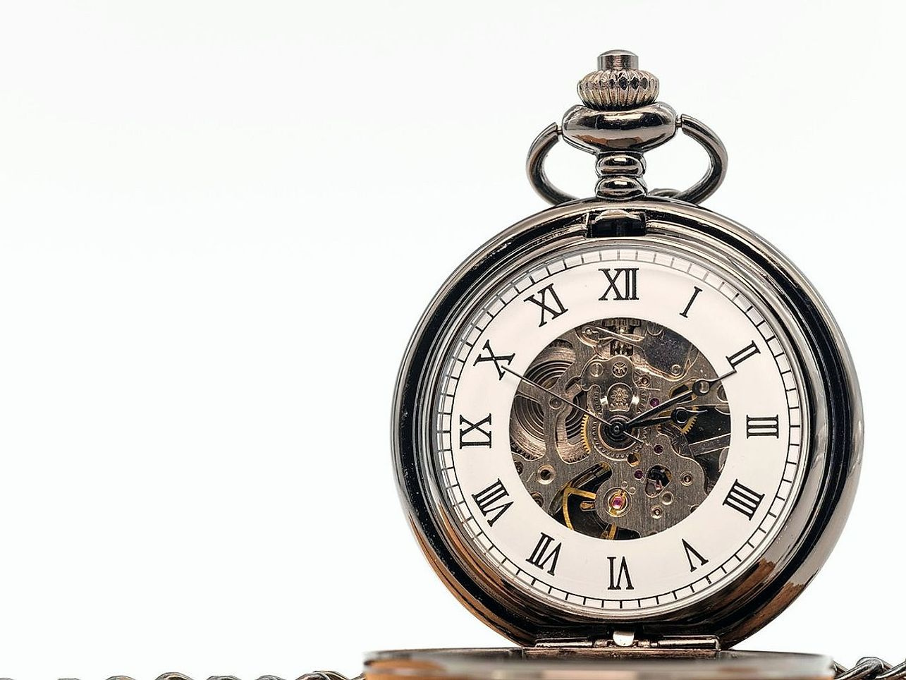 A brass clock face under a bright flash