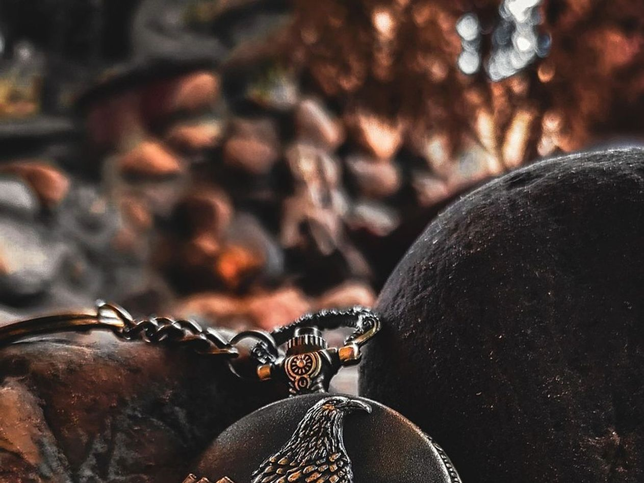 Intricate gears arranged over pale metal