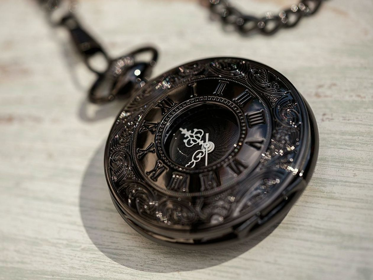 A disassembled movement laid out on a jeweler's cloth, gears catching the light